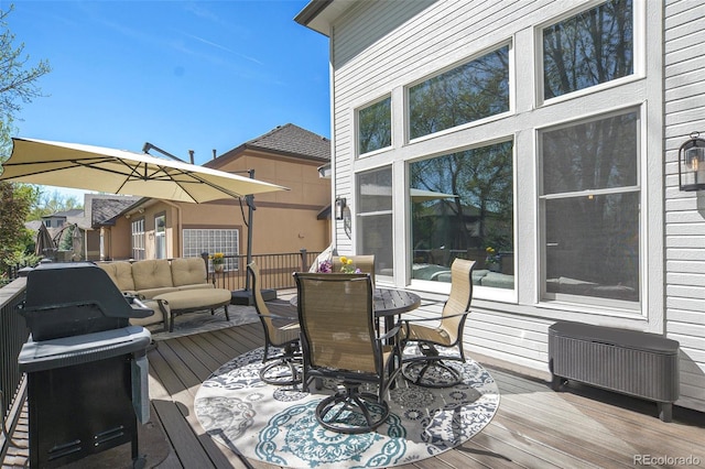 3002 S Oak Way, Lakewood, CO 80227 - wooden deck with outdoor dining space and an outdoor living space