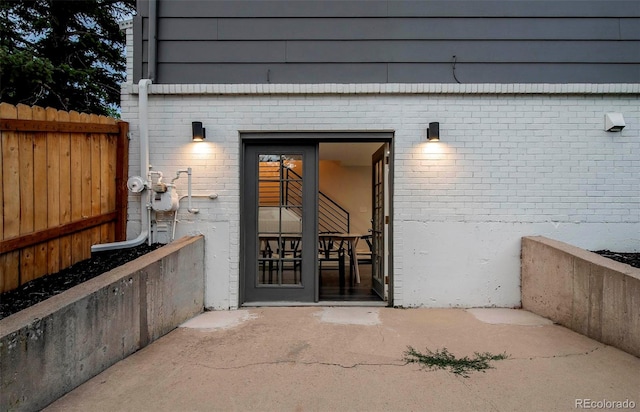 doorway to property featuring a patio