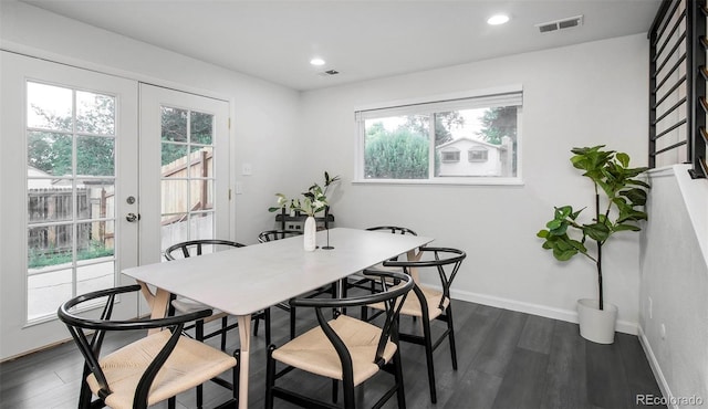 dining area with french doors and dark wood-type flooring