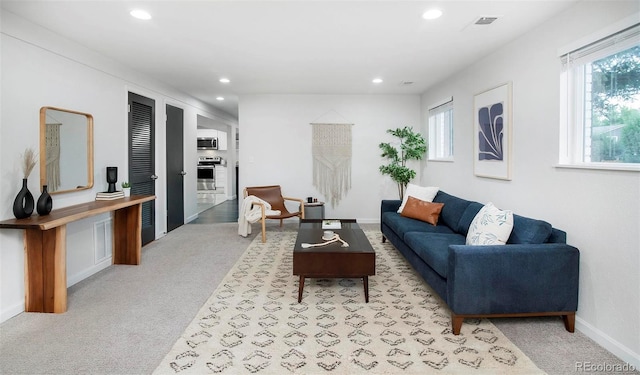 living room with light colored carpet