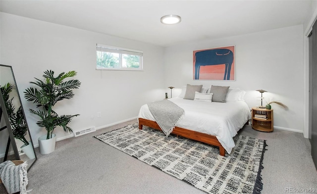 bedroom with light carpet