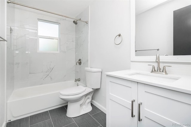 full bathroom featuring tiled shower / bath, vanity, and toilet