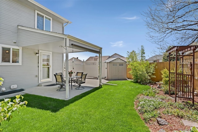 411 S Cody Ct, Lakewood, CO 80226 - view of yard with a storage unit, a patio area, and an outbuilding