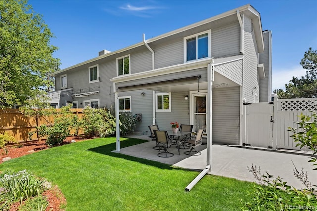 411 S Cody Ct, Lakewood, CO 80226 - rear view of property with a gate and a patio area