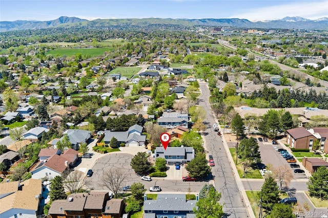 411 S Cody Ct, Lakewood, CO 80226 - aerial view of property and surrounding area featuring a mountain backdrop and nearby suburban area