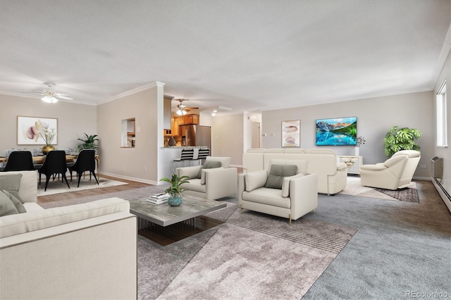 living room with ceiling fan, crown molding, and carpet floors