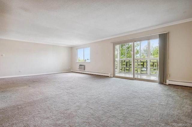 spare room featuring baseboard heating, crown molding, and carpet flooring