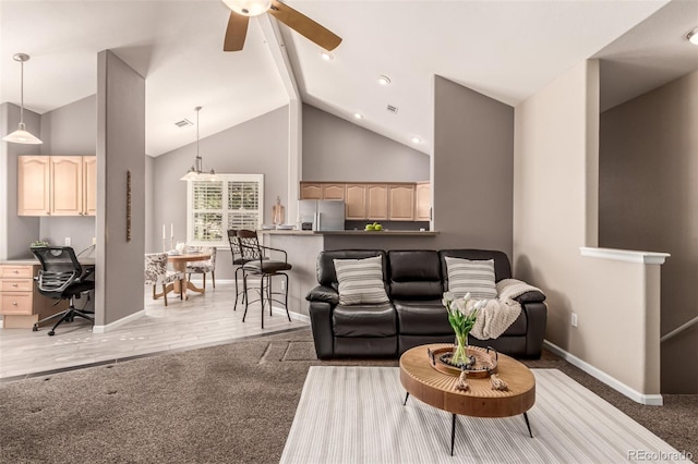 carpeted living room featuring baseboards, ceiling fan, beamed ceiling, wood finished floors, and high vaulted ceiling