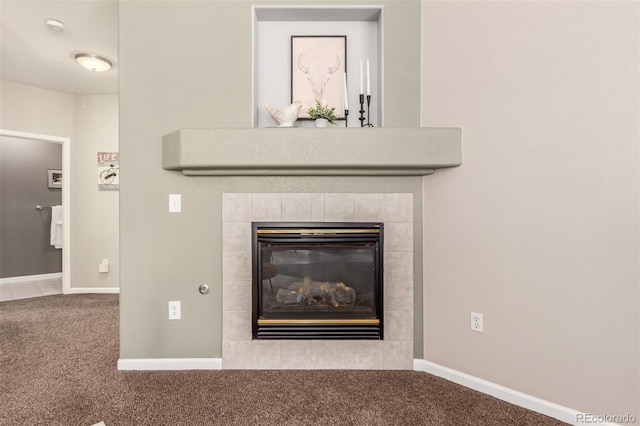 details with carpet floors, a tile fireplace, and baseboards