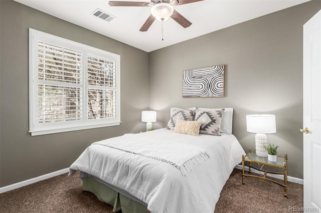 bedroom with carpet floors, visible vents, baseboards, and a ceiling fan