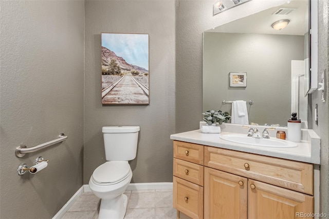 bathroom with visible vents, baseboards, toilet, tile patterned floors, and vanity