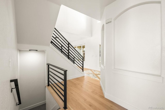 stairway featuring hardwood / wood-style floors