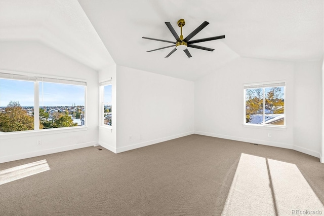 interior space with carpet floors, ceiling fan, and lofted ceiling