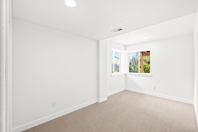 unfurnished room with carpet floors