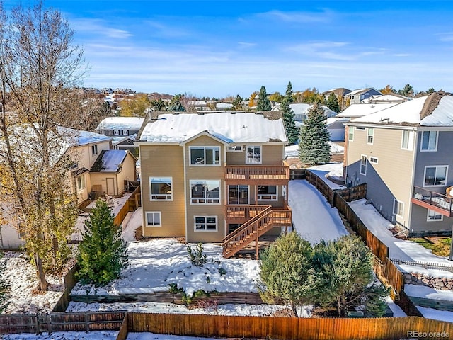 view of snow covered house