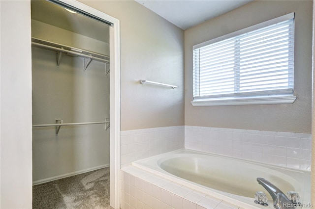 bathroom with tiled tub