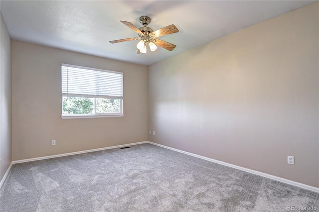 unfurnished room with carpet floors and ceiling fan