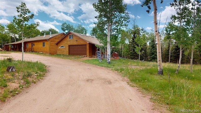 view of front of property with a garage