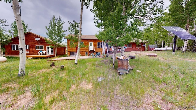 view of yard with a wooden deck