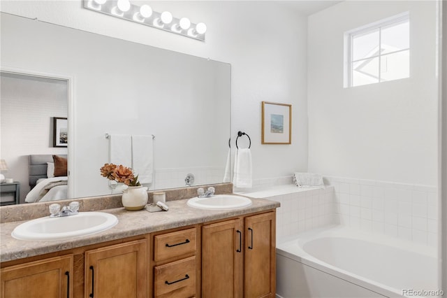 bathroom featuring vanity and a bath