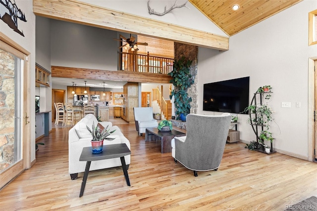 30717 Conifer Mountain Dr, Conifer, CO 80433 - living room featuring high vaulted ceiling, stairway, ceiling fan, light wood finished floors, and recessed lighting