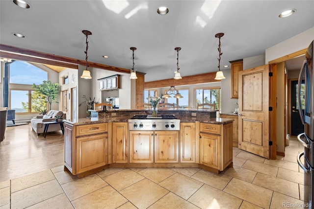 30717 Conifer Mountain Dr, Conifer, CO 80433 - kitchen featuring stainless steel gas stovetop, healthy amount of natural light, recessed lighting, pendant lighting, and dark stone counters