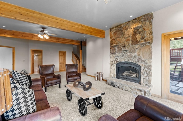 30717 Conifer Mountain Dr, Conifer, CO 80433 - carpeted living room with beam ceiling, stairs, ceiling fan, a stone fireplace, and recessed lighting