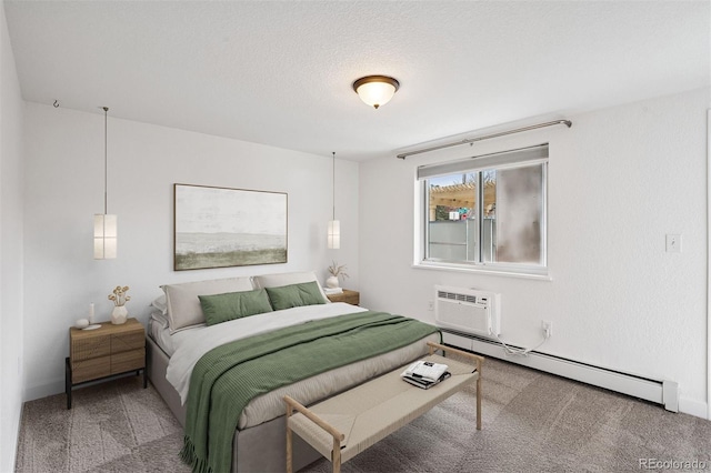 1 N Pearl St Unit 102, Denver, CO 80203 - bedroom featuring a baseboard heating unit, carpet flooring, and a wall mounted air conditioner