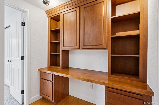 1 N Pearl St Unit 102, Denver, CO 80203 - unfurnished office featuring built in study area, a textured wall, and light wood-style flooring