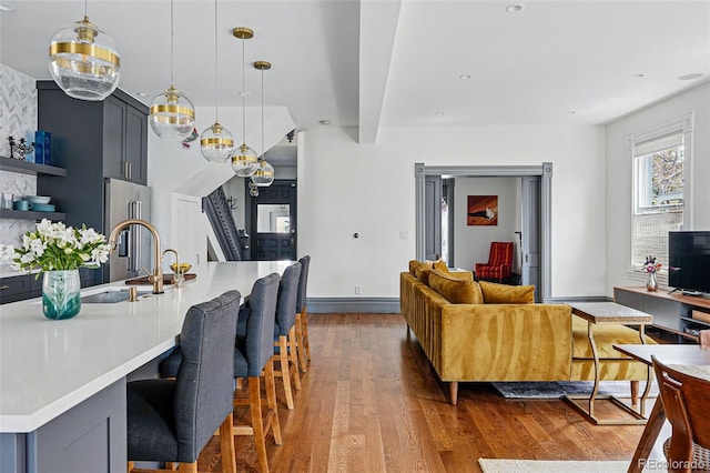 dining space with wood finished floors and baseboards