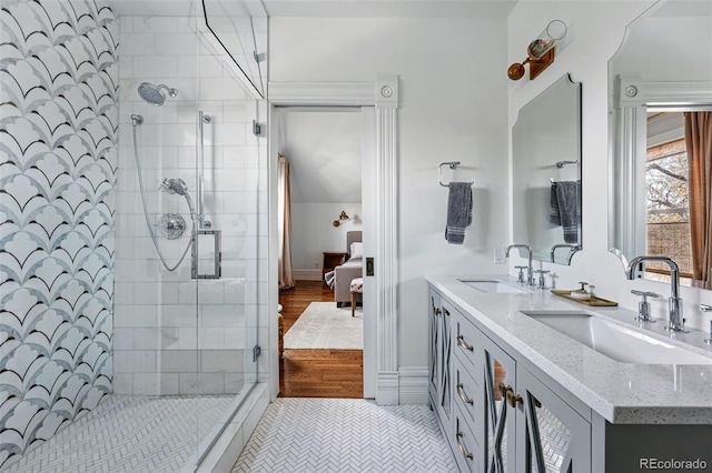 full bathroom with a stall shower, double vanity, connected bathroom, and tile patterned flooring
