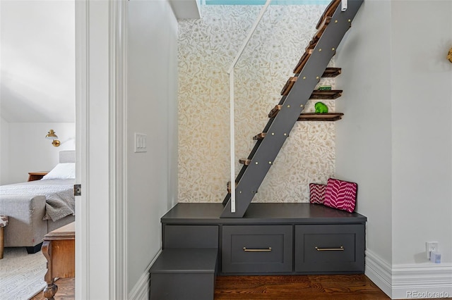 mudroom with wood finished floors and baseboards