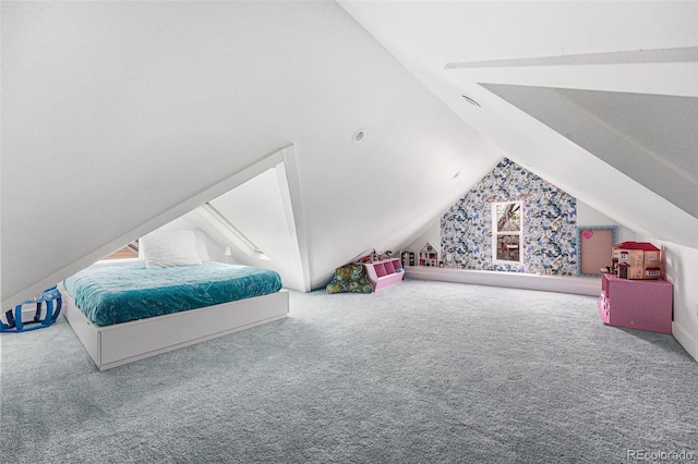 bedroom with vaulted ceiling and carpet floors