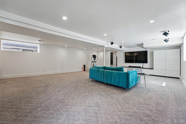 carpeted living area featuring baseboards and recessed lighting