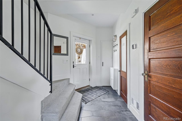 entryway with stairs
