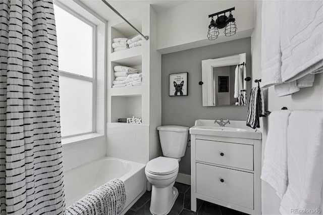 bathroom featuring toilet, tile patterned flooring, and vanity