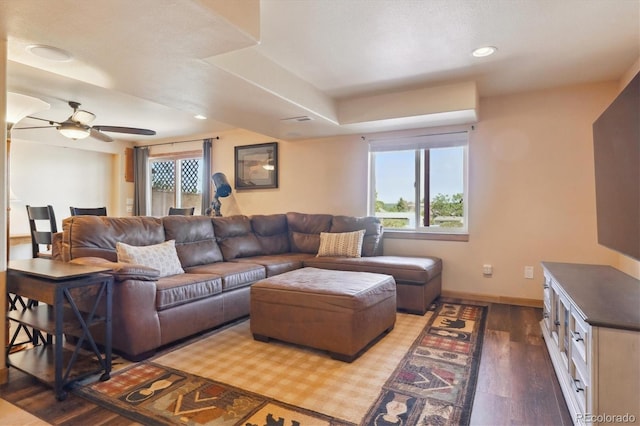 living area with wood finished floors, ceiling fan, baseboards, and recessed lighting