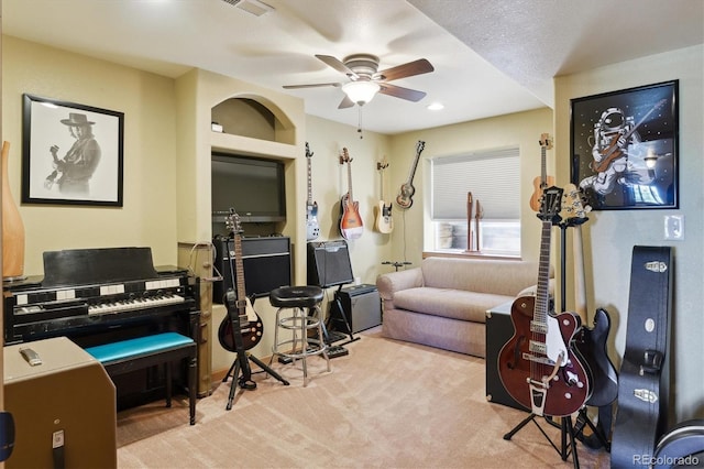 interior space featuring ceiling fan and carpet flooring