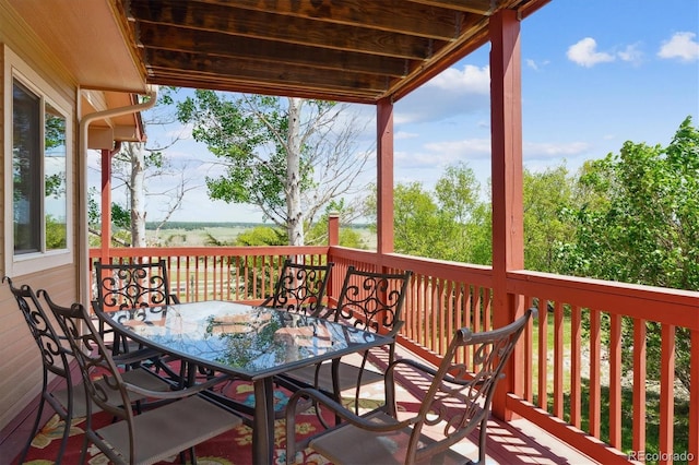 deck with outdoor dining space