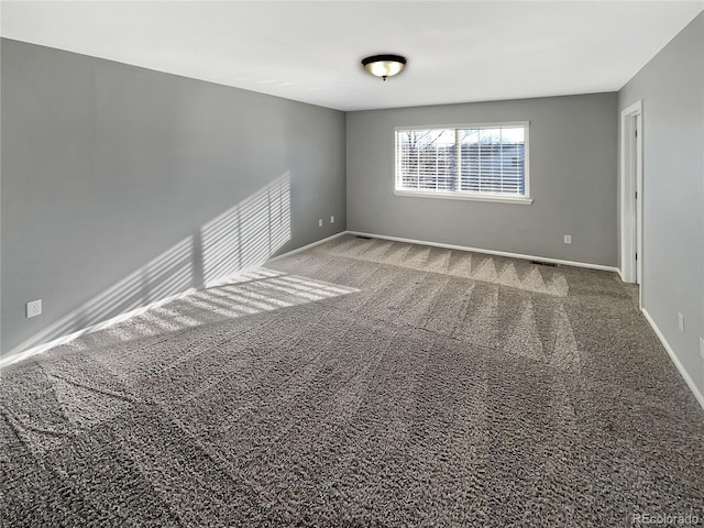 spare room featuring carpet floors