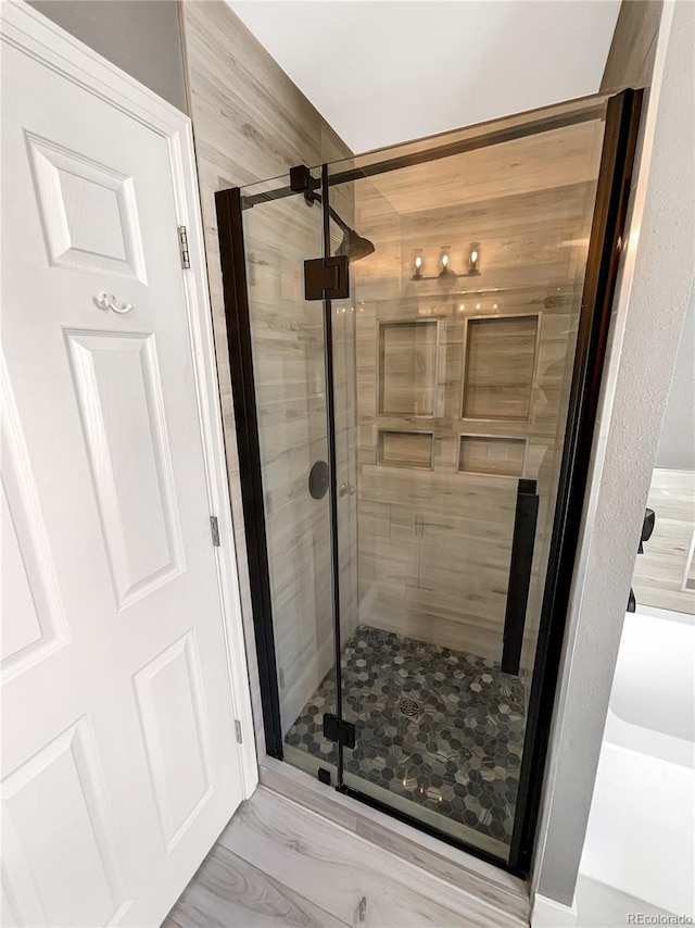 bathroom with an enclosed shower