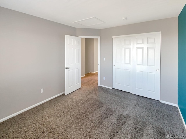 unfurnished bedroom with carpet floors and a closet