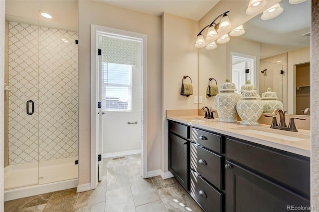 bathroom with vanity and walk in shower