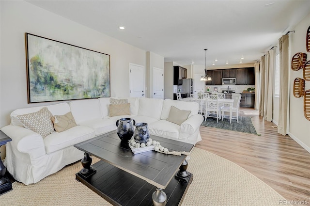 living room featuring light wood-type flooring