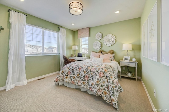 bedroom featuring light carpet