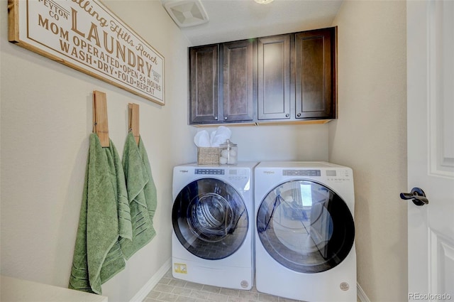 laundry area with cabinets and independent washer and dryer