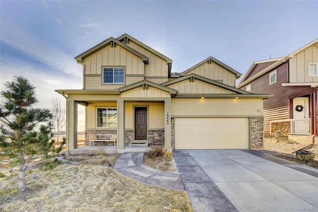 craftsman inspired home featuring a porch and a garage