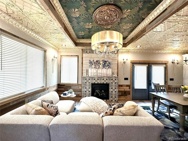 10704 Engelmann Ave, Salida, CO 81201 - living room featuring an ornate ceiling, a chandelier, wood finished floors, a fireplace, and a wainscoted wall