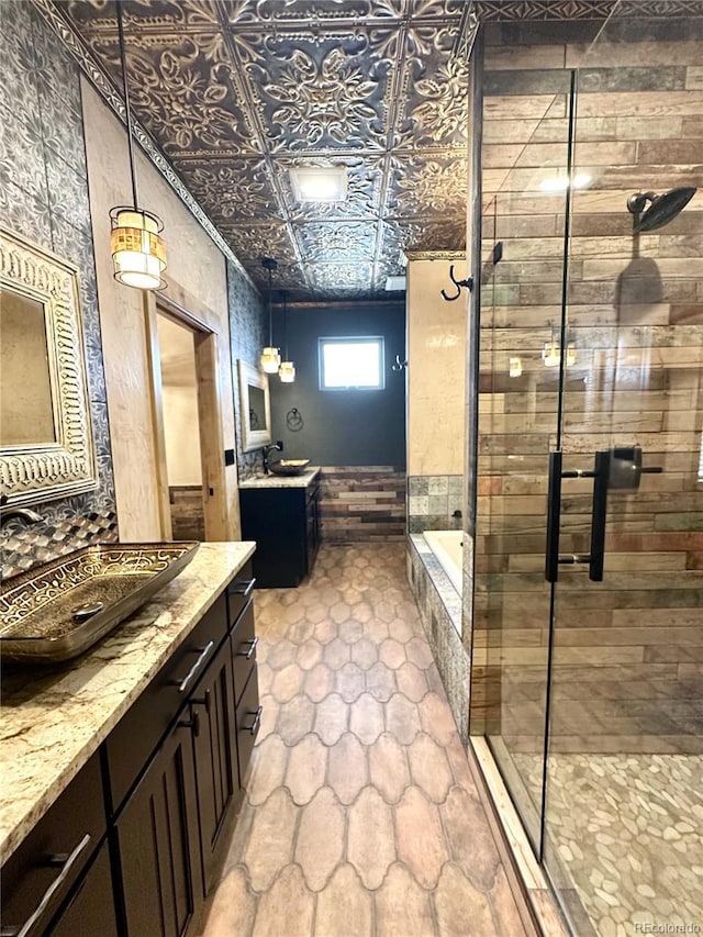 10704 Engelmann Ave, Salida, CO 81201 - bathroom with two vanities, a shower stall, tiled tub, and an ornate ceiling