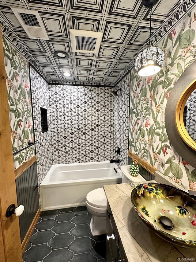 10704 Engelmann Ave, Salida, CO 81201 - bathroom with toilet, vanity, and an ornate ceiling